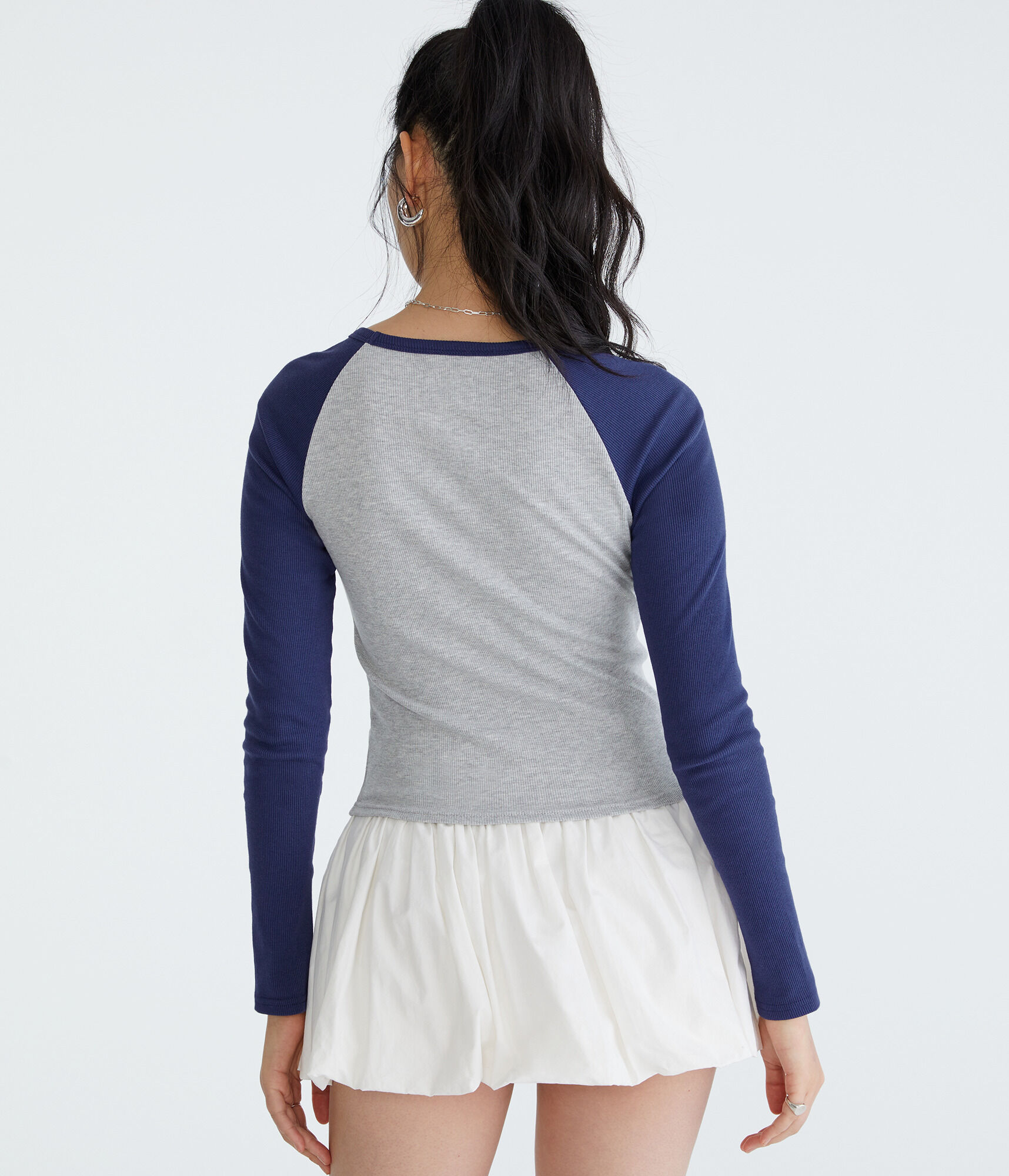 Peanuts&reg; | A&eacute;ropostale Long Sleeve Ice Skating Raglan Baby Tee