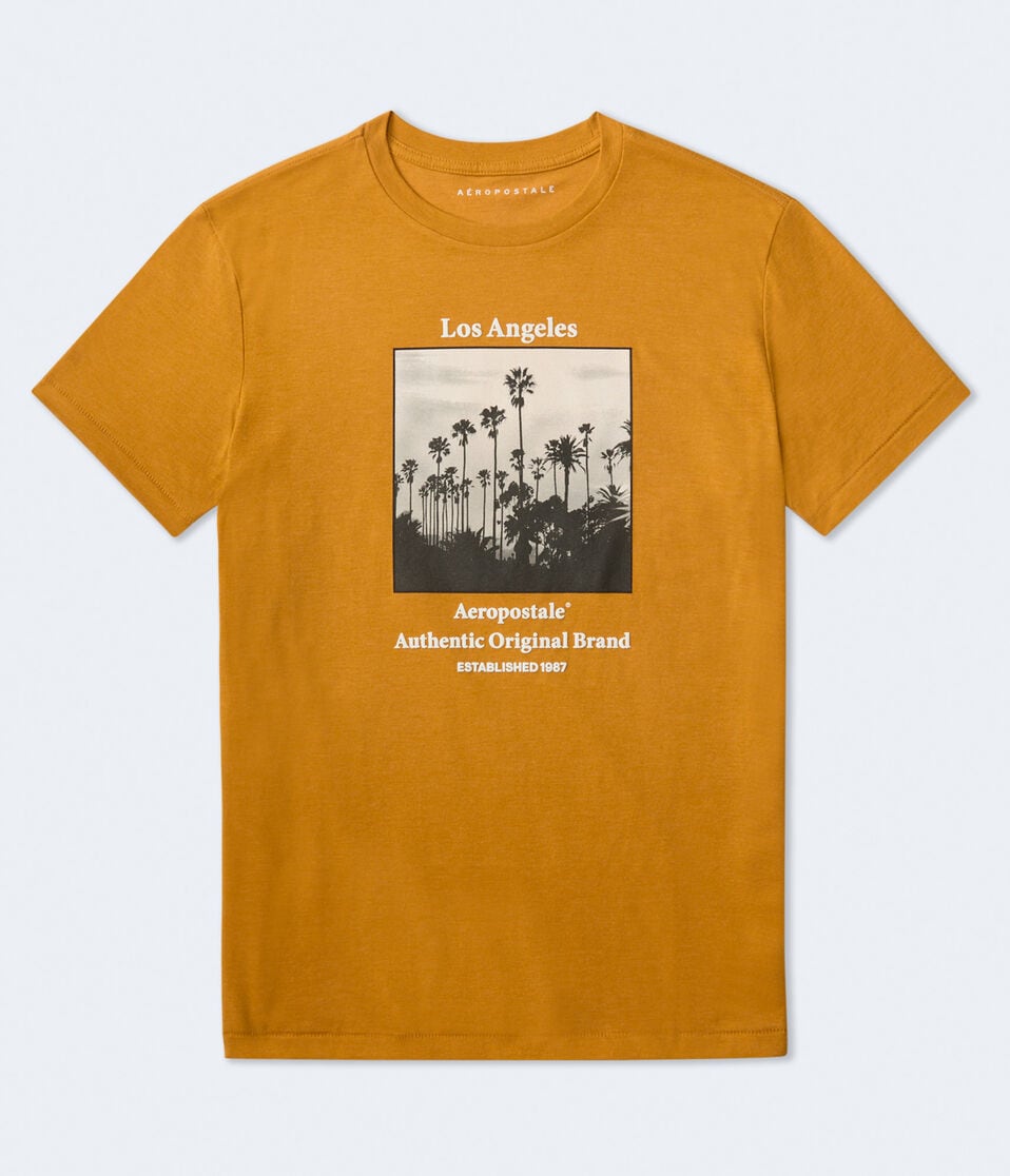 A yellow shirt with white text and a square black and white photo