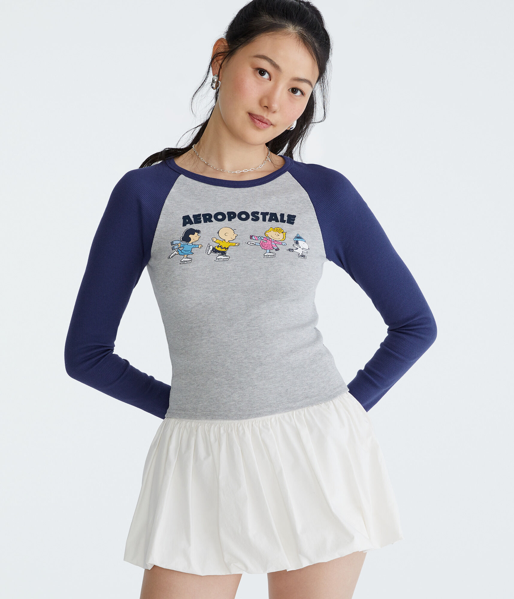 Peanuts&reg; | A&eacute;ropostale Long Sleeve Ice Skating Raglan Baby Tee