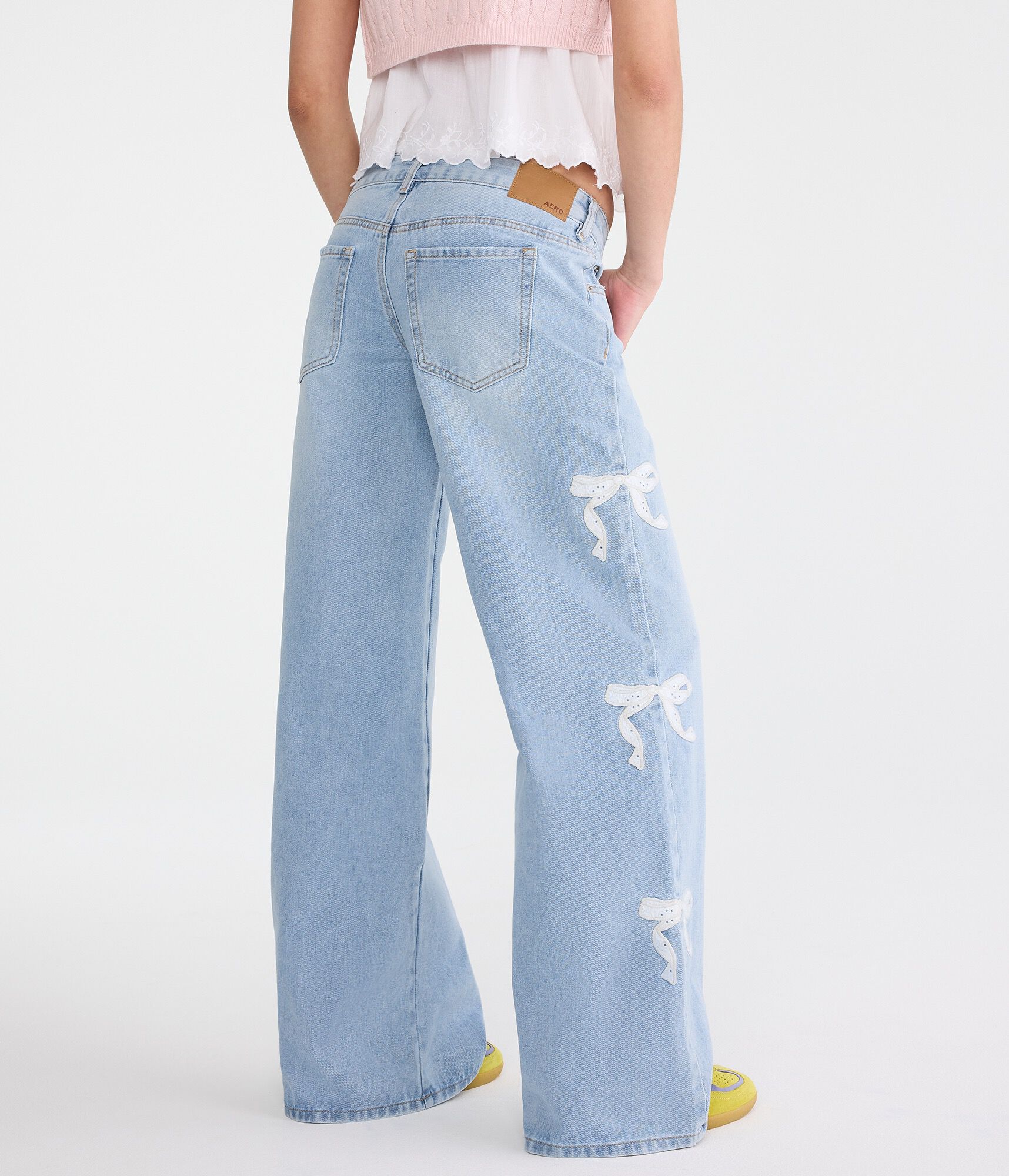 Super Low-Rise Ultra Wide Leg Eyelet Bow Jean
