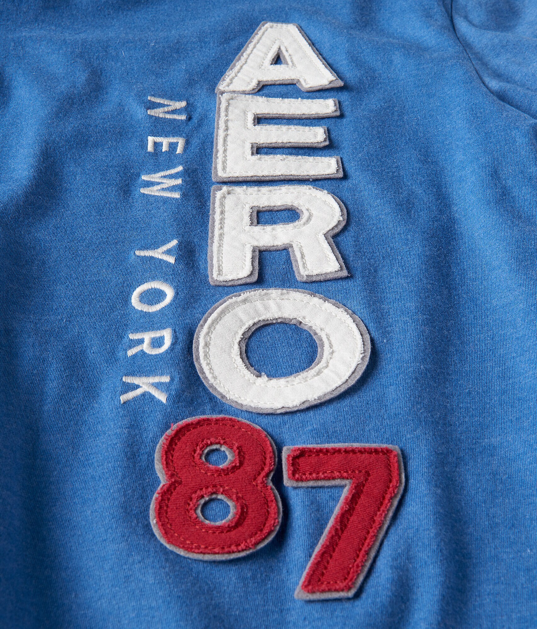 Vertical Aero 87 Logo Graphic Tee