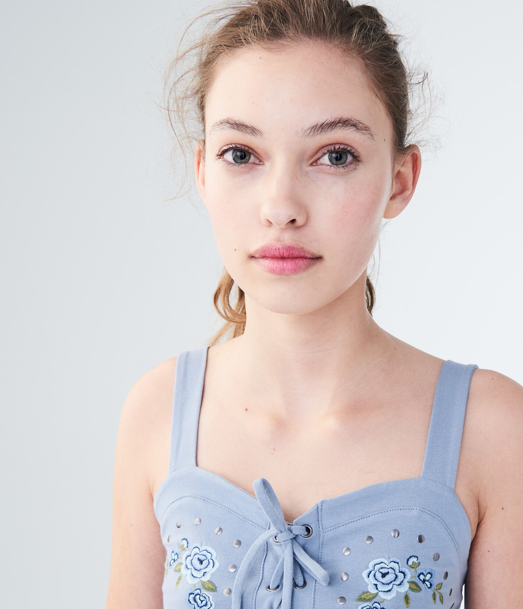 Embroidered Lace-Up Peplum Tank