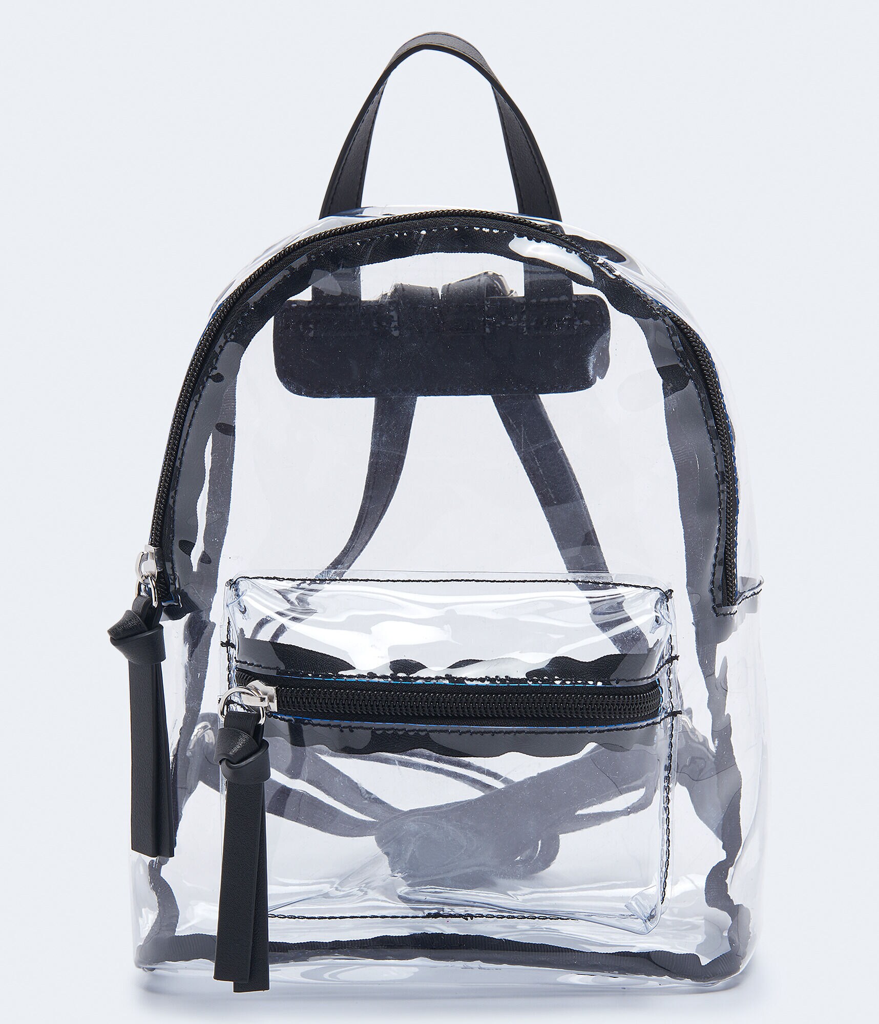 clear mini backpack nearby Ravinia Functional Storage Features one main compartment for larger items and a front zippered pocket to keep smaller essentials like keys POM POM CLEAR BACKPACK
